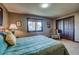 Bedroom with a comfortable-looking plush blue comforter and dark wood closet at 185 S Fuller Placer Rd, Breckenridge, CO 80424