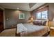 Comfortable bedroom features mountain views from the window and a cozy bed with decorative pillows at 185 S Fuller Placer Rd, Breckenridge, CO 80424