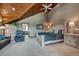Inviting bedroom with a wood ceiling, furnishings, and adjacent bathroom at 185 S Fuller Placer Rd, Breckenridge, CO 80424