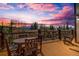 Outdoor deck with a wooden table and chairs offering scenic mountain views at 185 S Fuller Placer Rd, Breckenridge, CO 80424