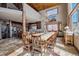 Dining room with a large wooden table, antler chandelier, and open access to the kitchen at 185 S Fuller Placer Rd, Breckenridge, CO 80424