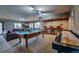 Entertainment room with pool table, shuffleboard, foosball table, and comfortable seating at 185 S Fuller Placer Rd, Breckenridge, CO 80424