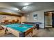Spacious recreation room with a pool table, shuffleboard, bar area, and ample room for entertainment at 185 S Fuller Placer Rd, Breckenridge, CO 80424