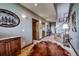 Hallway with wood accents, decorative artwork, and access to multiple rooms at 185 S Fuller Placer Rd, Breckenridge, CO 80424