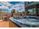 Relaxing hot tub on the deck with stunning mountain views in the background at 185 S Fuller Placer Rd, Breckenridge, CO 80424