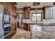 Kitchen with granite countertops, stainless steel appliances, and ample storage at 185 S Fuller Placer Rd, Breckenridge, CO 80424