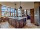 Open kitchen with an island and stone countertops, with stunning mountain views at 185 S Fuller Placer Rd, Breckenridge, CO 80424