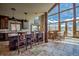 Open-concept kitchen with an island, bar seating, and large windows at 185 S Fuller Placer Rd, Breckenridge, CO 80424