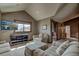 Cozy living room with seating area, a television, sloped ceilings, and scenic views at 185 S Fuller Placer Rd, Breckenridge, CO 80424