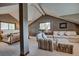 Cozy living room/bedroom combo with vaulted ceilings, plush seating, and natural light at 185 S Fuller Placer Rd, Breckenridge, CO 80424