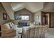 Comfortable living room featuring a vaulted ceiling, neutral tones, and a picturesque mountain view at 185 S Fuller Placer Rd, Breckenridge, CO 80424