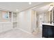 Finished basement featuring a bathroom and storage space with a modern vanity at 6150 Reed St, Arvada, CO 80003