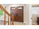 Inviting home entryway featuring decorative double doors and elegant trim at 6150 Reed St, Arvada, CO 80003