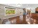 Spacious living room with large windows providing great natural light and opens up to a backyard deck at 6150 Reed St, Arvada, CO 80003