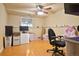 Bedroom featuring laminate floors, a ceiling fan, and natural light at 470 Mcdonnell St, Byers, CO 80103