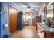 Cozy bedroom featuring wood floors, ample closet space, a ceiling fan, and vintage decor at 470 Mcdonnell St, Byers, CO 80103