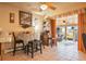 Cozy dining area with tiled floors, a table for four, and sliding doors to sunroom at 470 Mcdonnell St, Byers, CO 80103