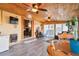 Inviting sunroom featuring wood paneled ceiling, tile floors, and natural light at 470 Mcdonnell St, Byers, CO 80103