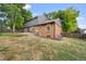 Large backyard with grass and a partially visible deck at 7910 E Bethany Pl, Denver, CO 80231