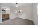 Bright finished basement bedroom with ensuite bathroom and new carpet at 7910 E Bethany Pl, Denver, CO 80231