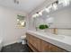 Elegant bathroom with double vanity and updated fixtures at 7910 E Bethany Pl, Denver, CO 80231