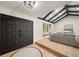 Modern entryway with black double doors and a view into the living room at 7910 E Bethany Pl, Denver, CO 80231