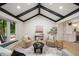 Living area with vaulted ceiling and open concept to kitchen at 7910 E Bethany Pl, Denver, CO 80231