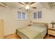 Bedroom with hardwood floors, ceiling fan and two large bright windows at 1060 N Washington St # 1A, Denver, CO 80203