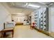 Bright laundry room featuring multiple washers and dryers, utility sink, and electrical meters at 1060 N Washington St # 1A, Denver, CO 80203