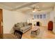 Bright living room with neutral walls, hardwood floors, and a ceiling fan at 1060 N Washington St # 1A, Denver, CO 80203