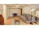 Cozy living room featuring hardwood floors, a ceiling fan, gray couch and area rug at 1060 N Washington St # 1A, Denver, CO 80203