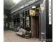 Vintage storefront with large windows, a bench, and rustic detailing at 1060 N Washington St # 1A, Denver, CO 80203