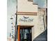 Hudson Hill storefront at 13th & Pearl featuring distinctive branding and outdoor lighting at 1060 N Washington St # 1A, Denver, CO 80203
