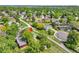 An aerial view shows the home nestled in a mature neighborhood with tree-lined streets at 3266 S Wabash Ct, Denver, CO 80231