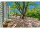Spacious wooden deck featuring mature shade tree, with built-in seating at 3266 S Wabash Ct, Denver, CO 80231