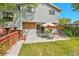 Backyard features a patio area for dining, a grassy lawn, and direct house access at 3266 S Wabash Ct, Denver, CO 80231