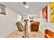 Finished basement with exercise equipment and comfortable seating area at 3266 S Wabash Ct, Denver, CO 80231