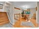 Inviting dining area with hardwood floors and a stylish chandelier, perfect for Gathering meals at 3266 S Wabash Ct, Denver, CO 80231