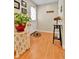 Cozy entryway with wood floors, a decorative rug, and a charming plant on a decorative table at 3266 S Wabash Ct, Denver, CO 80231