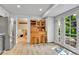 Open kitchen area featuring a stainless steel refrigerator, a hutch, and doors leading to the outside deck at 3266 S Wabash Ct, Denver, CO 80231