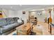 Finished basement living room with wood floors and comfortable seating at 3266 S Wabash Ct, Denver, CO 80231