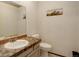 Cozy bathroom featuring stone-tiled countertop and neutral paint at 6327 S Emporia Cir, Englewood, CO 80111
