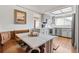 Kitchen with breakfast nook, featuring gray cabinets and stainless steel appliances at 6327 S Emporia Cir, Englewood, CO 80111