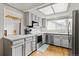 Kitchen with gray cabinets and stainless steel appliances at 6327 S Emporia Cir, Englewood, CO 80111