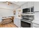 Kitchen with breakfast nook, stainless steel appliances and wood floors at 6327 S Emporia Cir, Englewood, CO 80111