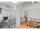 Kitchen with gray cabinets, stainless steel refrigerator, and breakfast nook at 6327 S Emporia Cir, Englewood, CO 80111
