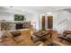 Spacious living room with stone fireplace, hardwood floors, and neutral decor at 6327 S Emporia Cir, Englewood, CO 80111