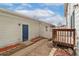 Backyard featuring a deck, brick patio and exterior door to the attached garage at 3974 W 118Th Pl, Westminster, CO 80031