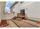 Backyard featuring a deck, brick patio, partial fencing and egress window to the basement at 3974 W 118Th Pl, Westminster, CO 80031