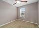 Empty bedroom featuring neutral paint, a ceiling fan, carpet floors, and a view out the window at 3974 W 118Th Pl, Westminster, CO 80031